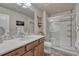 Bathroom featuring a vanity with solid countertops and a glass shower at 145 Kettle Valley Way, Monument, CO 80132