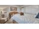 Comfortable bedroom with plush bedding, natural light and closet with sliding doors at 145 Kettle Valley Way, Monument, CO 80132