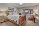 Bedroom featuring a wooden bed frame and a large window at 145 Kettle Valley Way, Monument, CO 80132