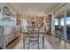Open dining space featuring a stylish table and seamlessly flowing into the kitchen at 145 Kettle Valley Way, Monument, CO 80132