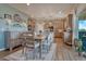 Bright dining area with modern light fixtures and an adjacent kitchen at 145 Kettle Valley Way, Monument, CO 80132