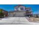 Charming two-story home with a three car garage and a well-manicured front yard at 145 Kettle Valley Way, Monument, CO 80132