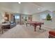 Game room featuring a pool table, carpet, and a walkout to the patio at 145 Kettle Valley Way, Monument, CO 80132