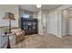 Hallway with display cabinet, wicker chair, and neutral carpet at 145 Kettle Valley Way, Monument, CO 80132