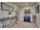 Hallway featuring an ornate side table, cabinet, and decorative dart board at 145 Kettle Valley Way, Monument, CO 80132