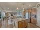 Spacious kitchen with granite island opens to the dining and living areas at 145 Kettle Valley Way, Monument, CO 80132