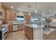Open kitchen with granite counters, stainless appliances, dining area, and living room beyond at 145 Kettle Valley Way, Monument, CO 80132