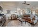 Spacious living room with a decorative fireplace and wood floors at 145 Kettle Valley Way, Monument, CO 80132