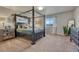 Main bedroom with a four-poster bed, dresser, and ample natural light at 145 Kettle Valley Way, Monument, CO 80132