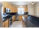 Spacious kitchen with stainless steel appliances, granite countertops, and ample cabinet space at 5137 Mt Arapaho Cir, Frederick, CO 80504