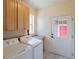 Laundry room with washer and dryer and storage at 5137 Mt Arapaho Cir, Frederick, CO 80504