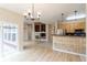 Open-concept living space showcasing a kitchen with granite countertops and a dining area at 5137 Mt Arapaho Cir, Frederick, CO 80504