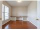 Bright office space featuring built-in shelving and hardwood floors at 5137 Mt Arapaho Cir, Frederick, CO 80504