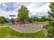 Community playground featuring swings, slides, and climbing structures, perfect for Gathering fun and recreation at 5137 Mt Arapaho Cir, Frederick, CO 80504