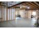 Unfinished basement with exposed beams and framing, offering potential for customization at 11880 W 38Th Pl, Wheat Ridge, CO 80033