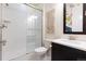 Clean bathroom features a glass-enclosed shower, modern fixtures, and a stylish vanity at 11880 W 38Th Pl, Wheat Ridge, CO 80033
