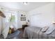 Bedroom with natural lighting, a teepee, and a decorative trunk at 11880 W 38Th Pl, Wheat Ridge, CO 80033