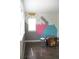 Bedroom with colorful mountain scene mural, hardwood floors and large windows at 11880 W 38Th Pl, Wheat Ridge, CO 80033