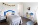 Nicely decorated bedroom with an animal head wall decoration and blue accent bedframe at 11880 W 38Th Pl, Wheat Ridge, CO 80033