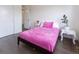 Bedroom features include hardwood floors, a comfortable bed, and ample closet space at 11880 W 38Th Pl, Wheat Ridge, CO 80033