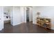 Hallway with hardwood floors showcasing bedroom entrances and a decorative bookcase at 11880 W 38Th Pl, Wheat Ridge, CO 80033