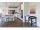 Bright kitchen features stainless steel appliances, pendant lighting, and a large center island with barstool seating at 11880 W 38Th Pl, Wheat Ridge, CO 80033