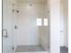 Modern bathroom featuring a glass-enclosed shower with subway tile and a built-in bench at 11880 W 38Th Pl, Wheat Ridge, CO 80033