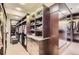 Organized walk-in closet with custom shelves, drawers, and ample storage space at 9470 S Silent Hills Dr, Lone Tree, CO 80124