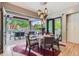 Dining room with seamless access to the outdoor entertainment area, dining, pool and bbq at 9470 S Silent Hills Dr, Lone Tree, CO 80124
