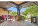 Cozy front porch featuring stone pillars, wood railing, and comfortable seating with a view of the neighborhood at 9470 S Silent Hills Dr, Lone Tree, CO 80124