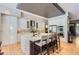 Modern kitchen with an eat-in island, stainless steel appliances, and designer finishes at 9470 S Silent Hills Dr, Lone Tree, CO 80124
