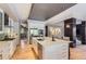 Spacious kitchen boasts white cabinetry, stainless appliances and a large island perfect for entertaining at 9470 S Silent Hills Dr, Lone Tree, CO 80124