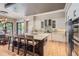 Modern kitchen with an eat-in island, stainless steel appliances, and designer finishes at 9470 S Silent Hills Dr, Lone Tree, CO 80124