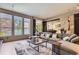 Expansive living room provides ample seating and natural light, ideal for relaxation and gatherings at 9470 S Silent Hills Dr, Lone Tree, CO 80124
