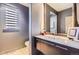 Stylish powder room featuring sleek vanity, modern fixtures, and tasteful decor elements at 9470 S Silent Hills Dr, Lone Tree, CO 80124