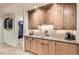 Basement wet bar featuring custom cabinetry, granite countertops and tile backsplash at 9470 S Silent Hills Dr, Lone Tree, CO 80124