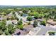 Aerial view displays a serene residential neighborhood with lush greenery and well-spaced houses at 16941 E Eastman Pl, Aurora, CO 80013