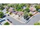 Aerial shot showcases a neighborhood featuring well-maintained homes, lush trees, and neatly paved streets at 16941 E Eastman Pl, Aurora, CO 80013