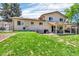 Well-maintained backyard with lush lawn, brick patio, and covered dining area at 16941 E Eastman Pl, Aurora, CO 80013