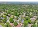 The aerial view of the property highlights a home nestled in a lush, green neighborhood at 11035 W 26Th Pl, Lakewood, CO 80215