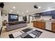 Finished basement with ample seating and a kitchenette at 11035 W 26Th Pl, Lakewood, CO 80215