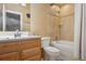 Bathroom features a tub, tiled shower, and a single sink vanity at 11035 W 26Th Pl, Lakewood, CO 80215