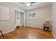 Bedroom features hardwood floors, and a built-in closet with shelves and drawers at 11035 W 26Th Pl, Lakewood, CO 80215