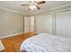 Bedroom with hardwood floors and a view to the hallway at 11035 W 26Th Pl, Lakewood, CO 80215