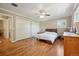 Spacious bedroom features hardwood floors and dual closets for ample storage at 11035 W 26Th Pl, Lakewood, CO 80215