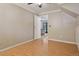 Bedroom featuring hardwood floors and view into another room at 11035 W 26Th Pl, Lakewood, CO 80215