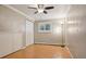 Bedroom featuring hardwood floors, crown molding, and a double closet at 11035 W 26Th Pl, Lakewood, CO 80215