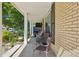Inviting front porch with seating area and lush landscaping, great for outdoor relaxation at 11035 W 26Th Pl, Lakewood, CO 80215