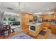 Spacious kitchen with wood cabinets, stainless steel appliances, and island with breakfast bar at 11035 W 26Th Pl, Lakewood, CO 80215