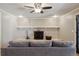 Inviting living room with a whitewashed brick fireplace and comfortable seating at 11035 W 26Th Pl, Lakewood, CO 80215